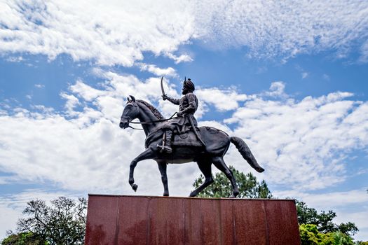 Jammu,India-April18th,2019:Beautiful horse riding statue of Maharaja Gulab Singh(1792-1858) - The founder of Jammu & Kashmir state with nice blue clouds in background sky.