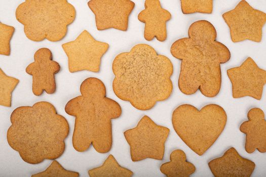 Gingerbread men stars and snowflakes not glazed cookies Christmas background