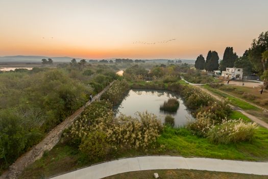 Sunrise view over wetland and ancient canal system, in En Afek nature reserve, northern Israel