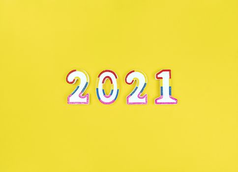 New year 2021 figures on yellow background.