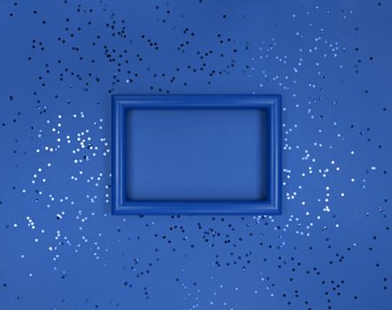 Frame and confetti stars on navy blue background.