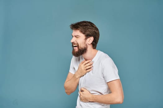 man in white t-shirt gesturing with his hands studio cropped. High quality photo