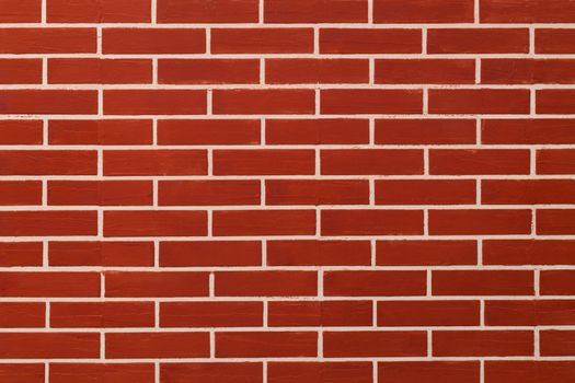 Brick red on wall background.