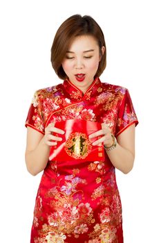 Asian girl got big surprise holding ung-pao or red porcket gift on isolated whith background.