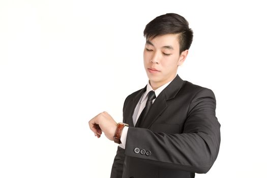 Young Businessman checking the time on his wrist watch : hurry time