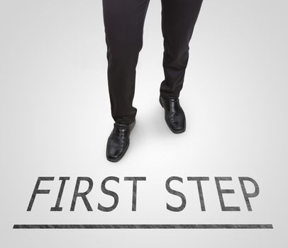 Businessman standing wearing court shoes on first step line.