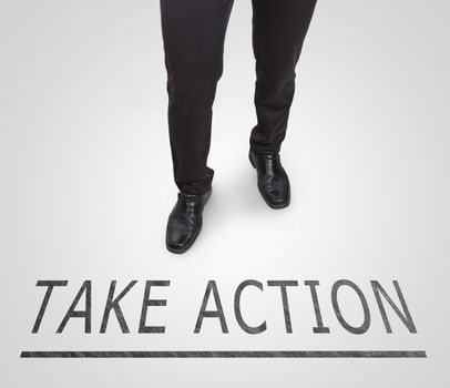 Businessman standing wearing court shoes on action line.