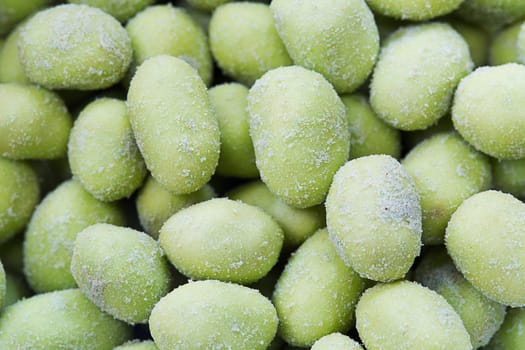 Closeup Wasabi coated peanuts.