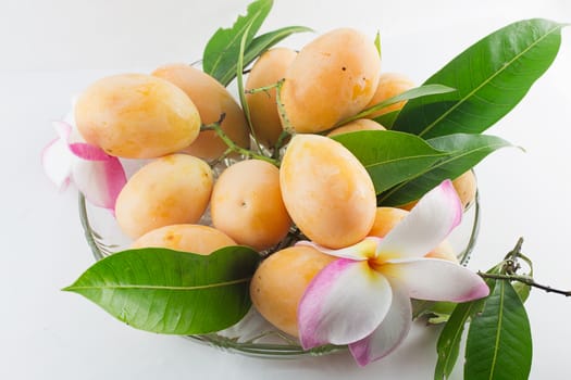 Maprang Marian Plum or Plum Mango on dish isolated white background.