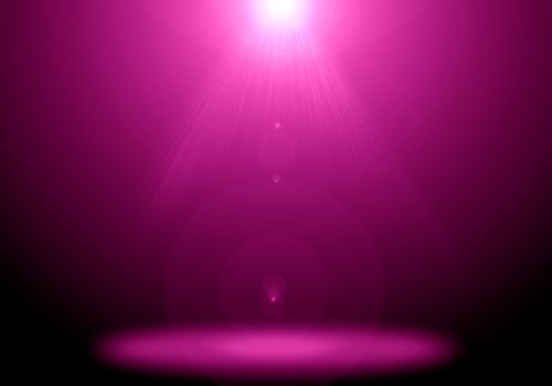 Abstract image of pink lighting flare on the floor stage.