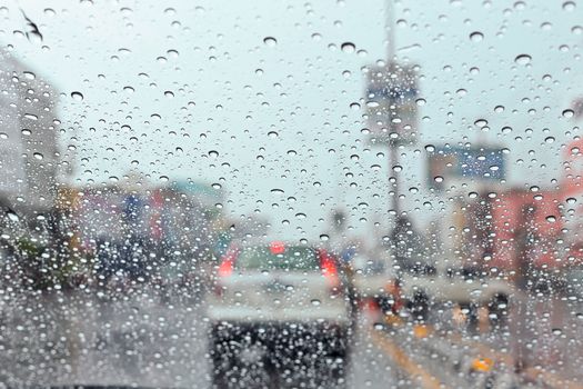 Water drop on traffic jam and electric light in the rain.