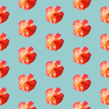 Seamless pattern with roses on a light gray-blue background. Flat lay, top view. Pop art creative design for textile, fashion, wallpaper, fabric, wrapping paper.