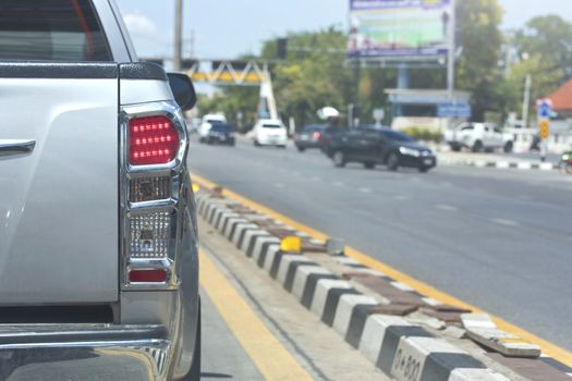 Truck Back light of city car on street.