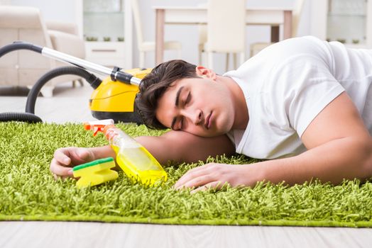 Young husband man cleaning floor at home