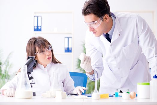Two lab doctor testing food products