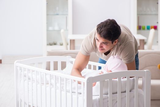 Young father dad frustrated at crying baby