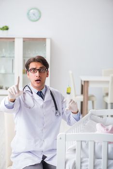 Doctor preparing for baby vaccination