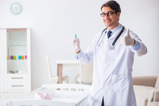 Doctor preparing for baby vaccination