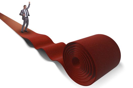 Businessman on red carpet isolated white background