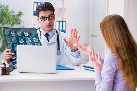 Doctor examining x-ray images of patient