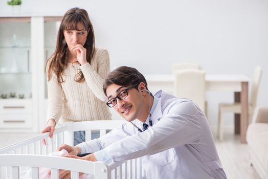 Doctor explaining to young mother 