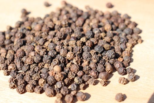 healthy and spicy Black Pepper stock on wooden background