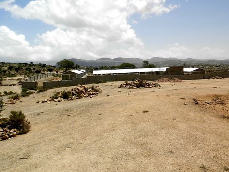 Tesseney, Eritrea - 10/11/2020: Beautiful photography of the landscape from the villages near the bord from Ethiopia. Old desert villages with some domestic animals.