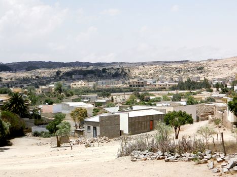 Tesseney, Eritrea - 10/11/2020: Beautiful photography of the landscape from the villages near the bord from Ethiopia. Old desert villages with some domestic animals.