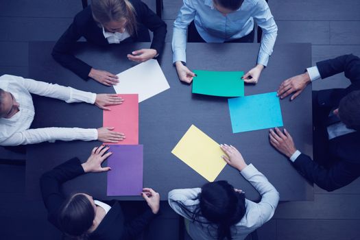 Group of business people with blank colorful paper, new project planning, opinion discussion concept