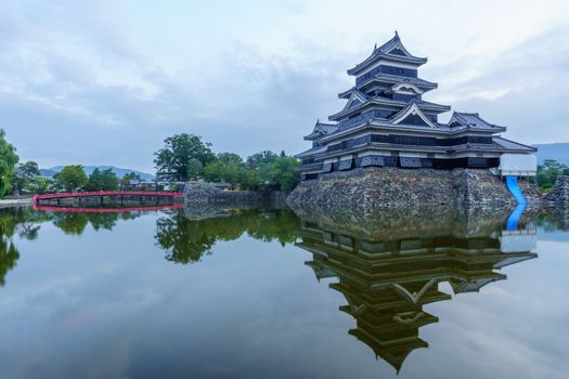 Sunrise view of the Matsumoto Castle (or Crow Castle) and bridge, in Matsumoto, Japan