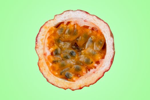 Maracuja cut in half and whole with leaf on green background. Passion fruit yellow with fruit juice and seeds