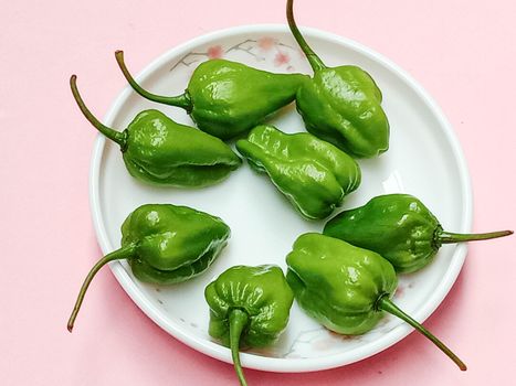healthy and spicy and hot green chilli stock on bowl