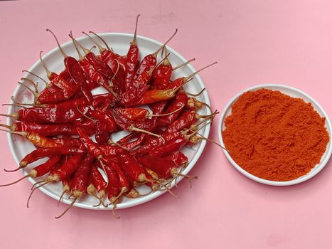 spicy and hot Red Dry Red Chilli stock and powder on bowl