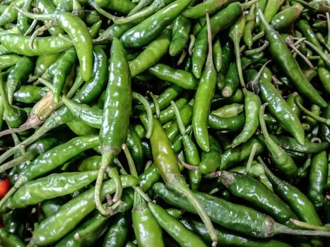healthy and spicy and hot green chilli stock on bowl