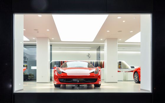 Red Ferrari 458 Italia in showroom in London, UK