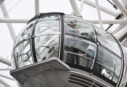 LONDON, UK - CIRCA SEPTEMBER 2011: People enjoying the view from one the London Eye capsule.