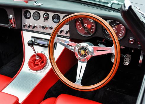 LONDON, UK - CIRCA SEPTEMBER 2011: Eagle E-Type Speedster dashboard, red leather seats. The Eagle E-Type is a restored and modified Jaguar E-Type.