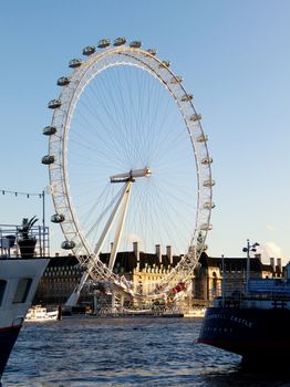 LONDON, UK - CIRCA JANUARY 2012: The London Eye next to the river Thames.