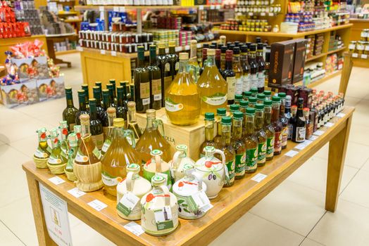 EDINBURGH, SCOTLAND - CIRCA NOVEMBER 2012: Choice of olive oil bottles at Jenners department store.