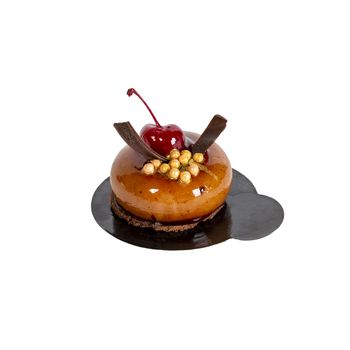Appetizing cake isolated on a white background on a dark stand. Gourmet cooking. Haute cuisine. Drunk cherry