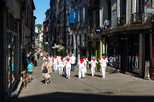 BAYONNE, FRANCE - JUNE 21, 2020: A traditional Basque music band plays music through the street of the town centre for Music Day 2020.