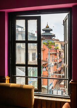 KATHMANDU, NEPAL - CIRCA APRIL 2018: Window with a view on Kathmandu Durbar Square.