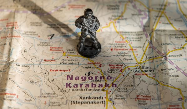 A figurine of an armed soldier on the map of Nagorno-Karabakh.