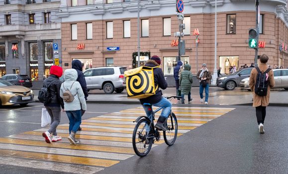 January 21, 2020 Moscow, Russia. An employee of the Yandex Food delivery service on a Moscow street.