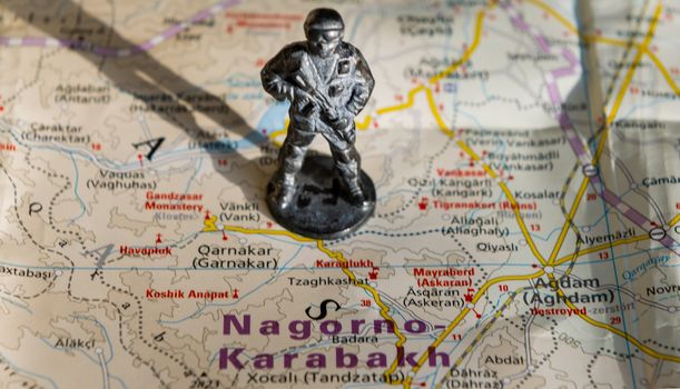 A figurine of an armed soldier on the map of Nagorno-Karabakh.