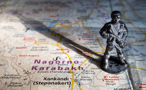 A figurine of an armed soldier on the map of Nagorno-Karabakh.