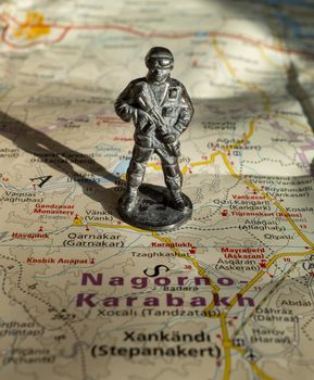 A figurine of an armed soldier on the map of Nagorno-Karabakh.