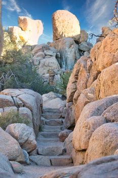 rocks and boulders with stairs carved in stone in Joshua Tree National Park, California, United States of America. Travel and Tourism.