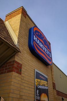 Ottawa, Ontario, Canada - November 6, 2020: A Harvey's logo sign on the wall of a restaurant in Ottawa.