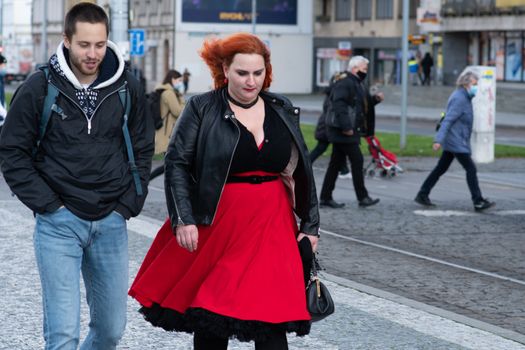 Czech Republic. A young couple is waiting for a tram at Hradcanska tram stop during quarantine. This is a lockdown period in the Czech Republic due to the increase of COVID-19 infectious in the country. Hradcanska tram stop it is in Prague 6